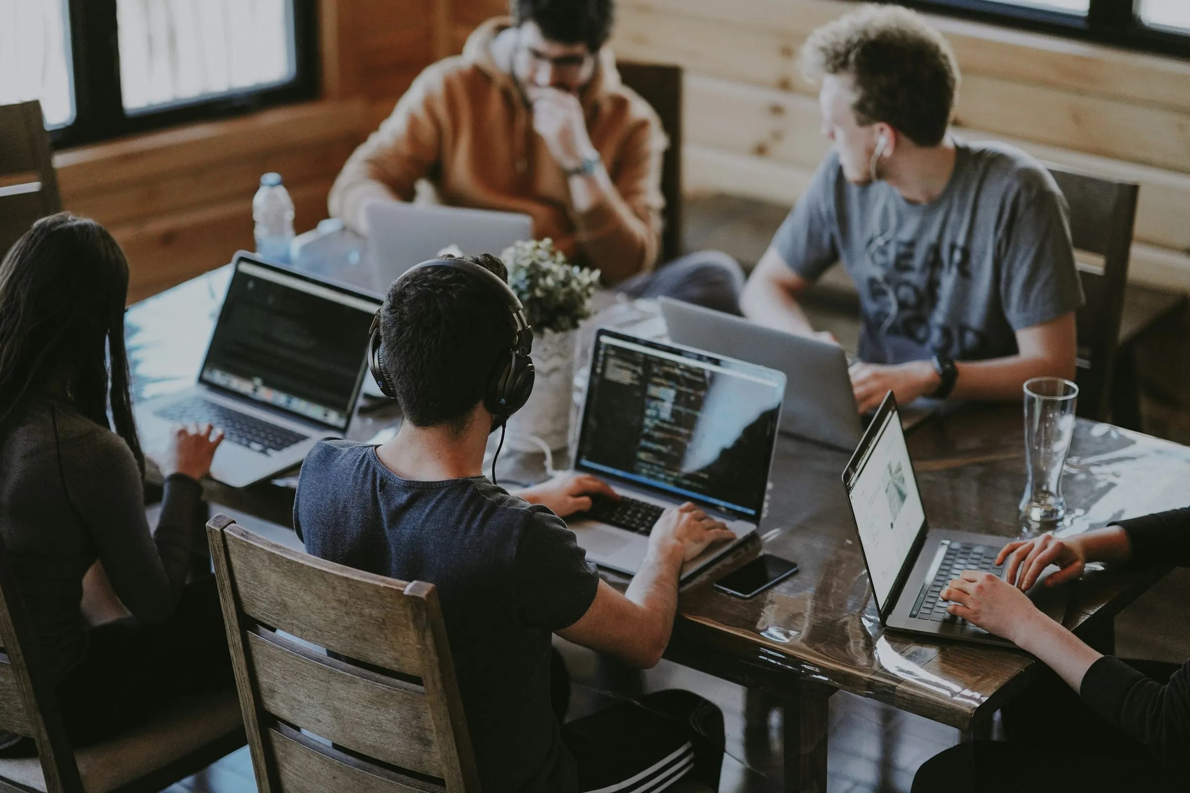 Quantum Craft's team working together at a shared desk in the London studio